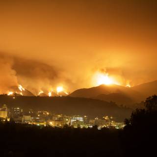 Inferno Engulfs the City and Mountains