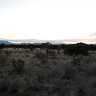 Desert Twilight Over Distant Mountain Peaks
