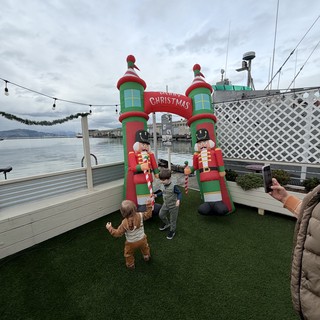 Children Playing at Waterfront Christmas Display