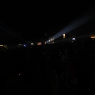 Dark Crowd Surges Under Spotlight Beam at Wobbleland