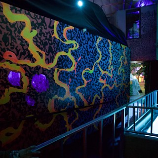 Vibrant UV-Reactive Mural in Contemporary Gallery Space