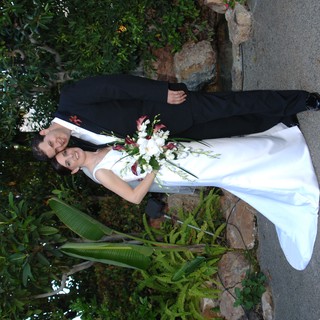 Newlyweds Pose Together in Garden Wedding Portrait