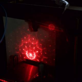 Red Laser Light Illuminates Computer Screen