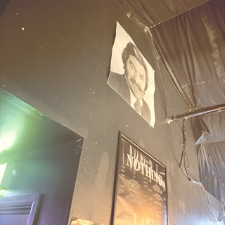 Industrial Nightclub Interior with Portrait and Poster