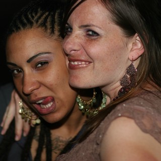 Two Friends Share a Joyful Moment at Nightclub