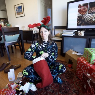 Penelope Opens Christmas Stocking in Festive Pajamas