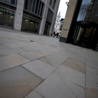 Modern Urban Plaza Leading to Historic Church Tower