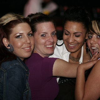 Four Friends Celebrating at a Nightclub in 2006