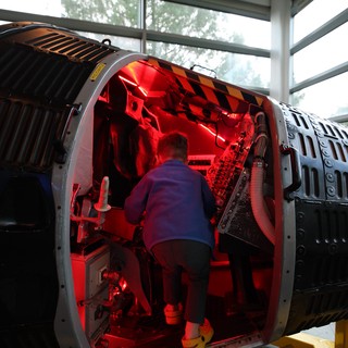 Inside the Red-Lit Interior of Historic Aircraft Fuselage