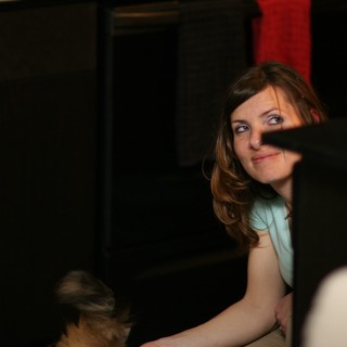 Curious Glance Behind Dark Furniture at Home