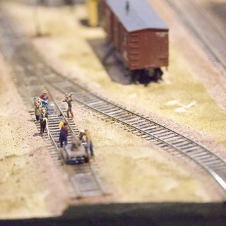 Miniature Railway Workers on Model Train Track Diorama