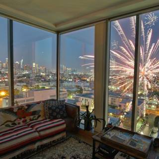 A Breathtaking Cityscape View from a Cozy Living Room