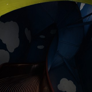 Underneath Dumbo's Yellow Wing at Fantasyland