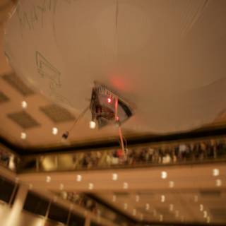 Illuminated Balloon in Indoor Auditorium