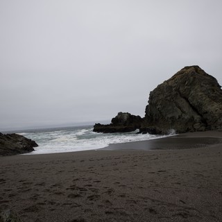 Moody Cove at Dusk with Dramatic Sea Stack