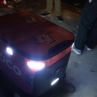 Coco Delivery Robot Navigates Nighttime Festival Crowd