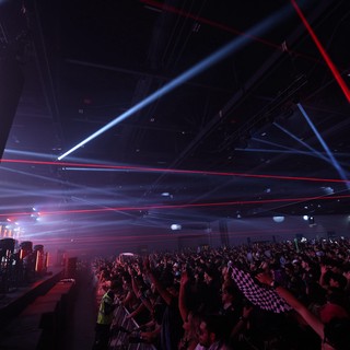 Laser Light Storm Over Pulsing Festival Crowd