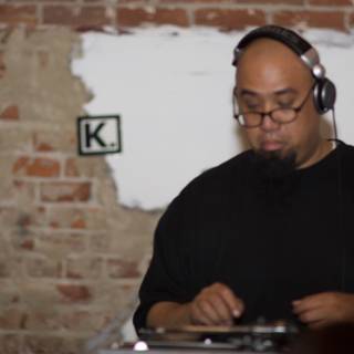 DJ Rhettmatic Spinning Beats with Headphones