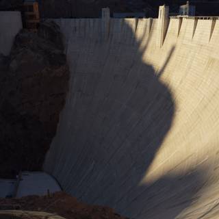 The Majestic Hoover Dam Casts Its Shadow on the Water