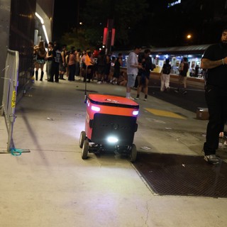 Autonomous Delivery Robot Navigates Nighttime Festival Crowd
