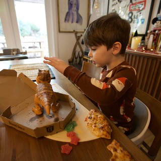 Child's Wonder at Christmas Pizza Dinosaur Meal