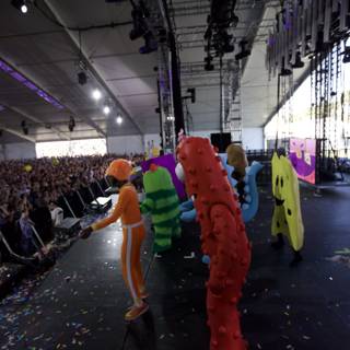 Stage Performance with Costumed Crowds