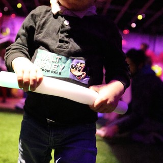 Toddler with Glow Sticks at Baby Rave Event