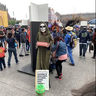 Skeleton Man Holds Protest Sign in Festival Crowd