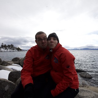 Playful Couple Posing at Snowy Lake Tahoe Shore
