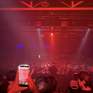 Electric Red Concert Atmosphere with Massive Crowd