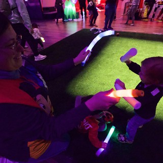 Children Playing with Glowing Toys at Baby Rave