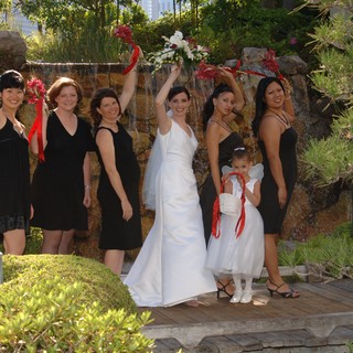 Joyful Bridal Party Celebrates at Garden Waterfall