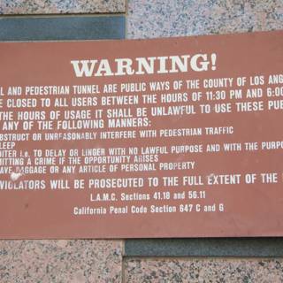 Warning Plaque on Building Wall