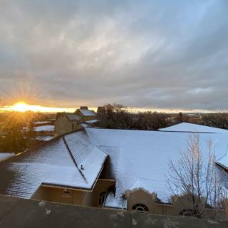 Sunset over Snowy Rooftops