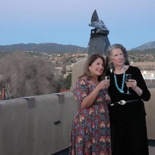 Rooftop Portrait: Two Women with a Mountain View