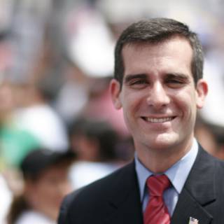 Eric Garcetti in a Suit and Tie Smiling at the Crowd