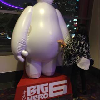 Standing next to a giant inflatable penguin