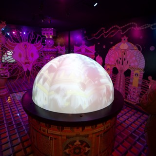 Illuminated Crystal Ball Display in Vibrant Art Installation
