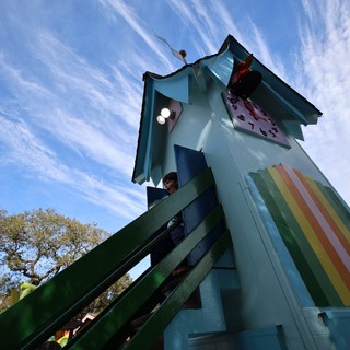 Child Climbing Colorful Rainbow Tower at Fantasyland