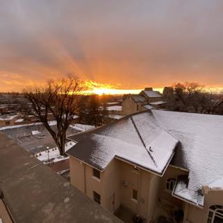 Snowy Rooftop Sunset