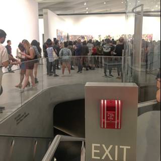 Museum Crowd Observing Exit Sign