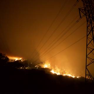 Station Fire Engulfs Power Lines and Trees