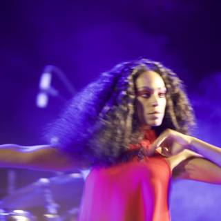 Solange Takes the Stage in a Red Dress