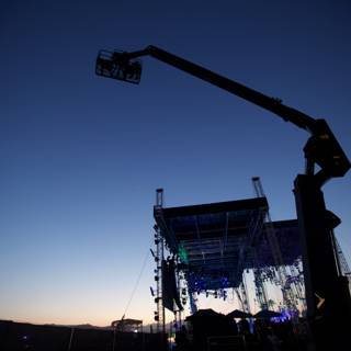 Elevated Stage Silhouette Against Dusk Sky