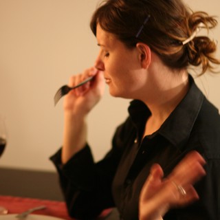 Woman Dining with Red Wine at Intimate Dinner
