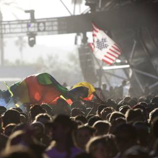 Concert-goers Wave Flags in Unison