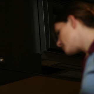 Blurred Profile in Dim Kitchen Light