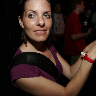 Woman at Nightclub Event Displaying Entry Wristband