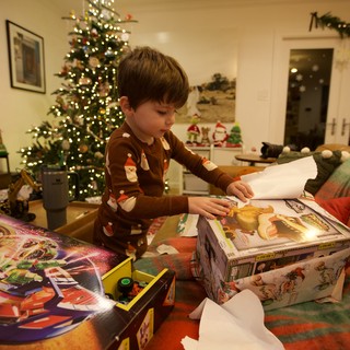 Christmas Morning: Child Opening Presents