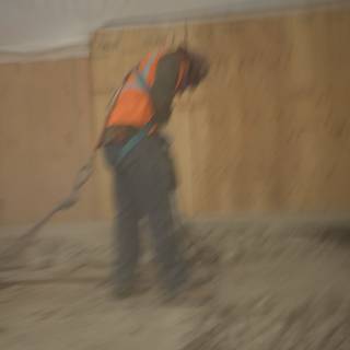 Plywood Worker on Concrete Floor